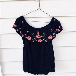 Black- off the shoulder top, with flowered ruffle